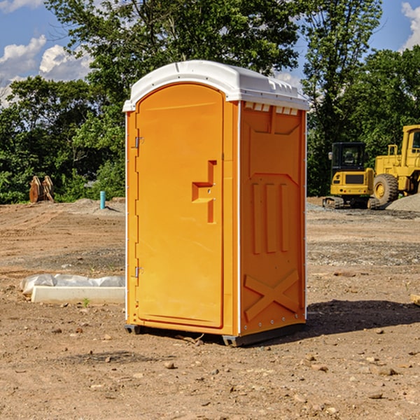 how often are the portable restrooms cleaned and serviced during a rental period in Busby